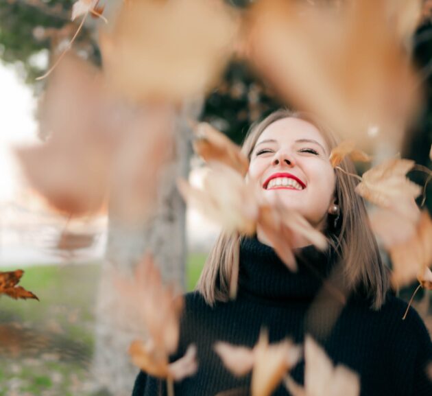 Woman in autumn season joyful